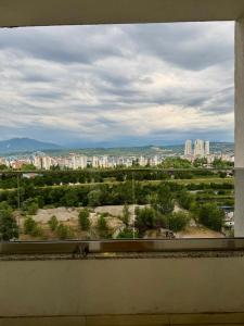 a view of a city from a window at Skyline Apartment Skopje in Madžari