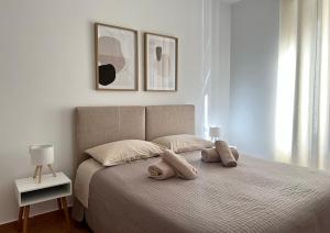 a bedroom with a bed with two pillows on it at Cascina Volpi in Montegrino Valtravaglia