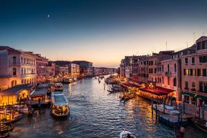 a view of a canal with boats in a city at Venice Cappucina Guest House in Mestre +24 photos