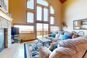 a living room with a couch and a fireplace at Amazing Overlook in McHenry
