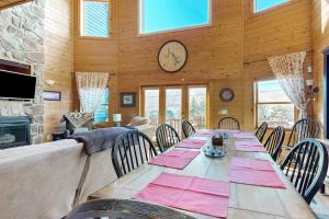 a dining room with a long table and chairs at Cedar Shores #15 in McHenry