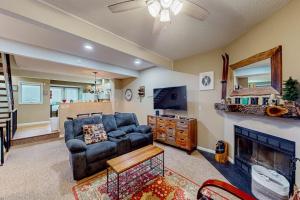 a living room with a couch and a tv at Stella's Retreat in McHenry