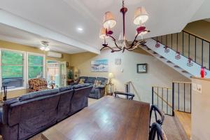 a living room with a couch and a dining room table at Stella's Retreat in McHenry +19 photos
