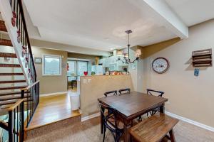 a dining room and kitchen with a table and chairs at Stella's Retreat in McHenry