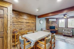 a dining room with a table and chairs at Ski Cove #2 in McHenry