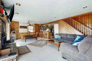 a living room with a couch and a table at Nimba Cabin in Oakland