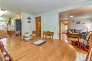 a living room with a wooden table and a couch at Still Meadows in Oakland