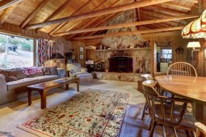 a living room with a couch and a fireplace at Pee Wee Acres in Swanton