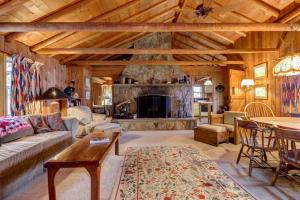 a living room with a couch and a fireplace at Pee Wee Acres in Swanton