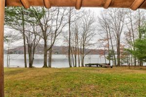 a picnic table in a park next to a lake at Pee Wee Acres in Swanton
