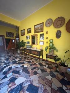 a living room with a colorful tile floor at Casa di Nonna Vanda in Sestu