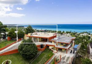 an aerial view of a house with the ocean in the background at Villa del Enseuno- Pristine View and Infinity Pool in Luquillo
