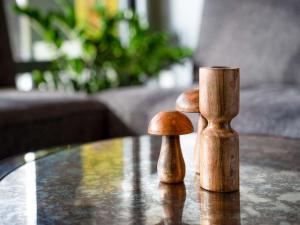 two wooden mushrooms sitting on top of a table at ibis Styles Chatenay Malabry Paris Sud in Châtenay-Malabry