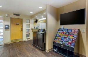 a store with a display of merchandise on a wall at Extended Stay America Suites - Boston - Woburn in Woburn