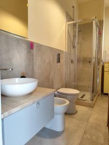 a bathroom with a sink and a toilet and a shower at B&B Vuiariello in Montefusco +38 photos