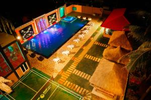 an overhead view of a swimming pool at night at Hotel White House in Anuradhapura