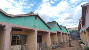 a row of buildings on a street at Life Vision Hotel in Huye +13 photos