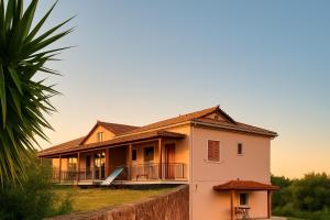 a house with a fence in front of it at 4T apartments in Argostoli