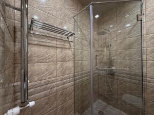 a shower with a glass door in a bathroom at Lalaner Hotel in Sisian