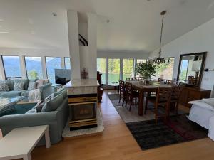 a living room with a couch and a fire place at Whales house in Horseshoe Bay