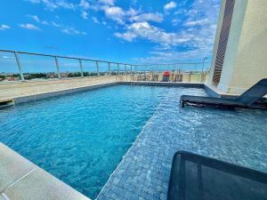 a swimming pool on top of a building at Maxplaza Residential 1209 in Canoas