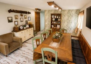 a dining room with a wooden table and chairs at Casa Rural Pablo in Ara