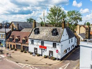 an overhead view of a white building on a street at Cross Keys Hotel Chatteris in Chatteris +83 photos