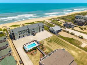 an aerial view of a resort with a swimming pool and the beach at SW6 - Seawalk 6 in Kill Devil Hills
