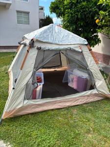 a tent sitting on the grass in a yard at Green Oasis Retreat in Bar