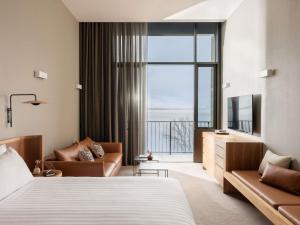 a hotel room with a bed and a large window at Wonil Hotel Perth - Handwritten Collection in Perth +129 photos