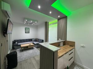 a kitchen and living room with a green ceiling at Villa Lux Una in Bosanska Krupa