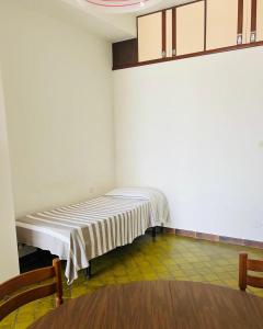 a room with a bed in the corner of a room at Lido del Sole bilo 28 in Rodi Garganico
