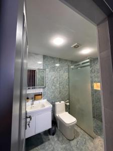 a bathroom with a toilet and a sink and a shower at Relax Beach Astara in Astara +29 photos
