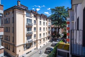 a view of a city street with buildings at Boutique Suites in Lugano