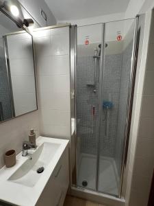 a bathroom with a shower and a sink at Il Nido in Anghiari +6 photos