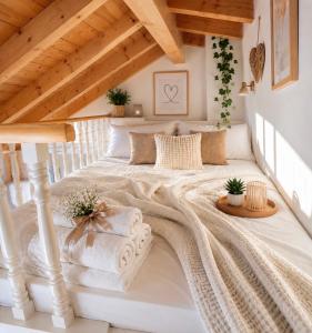a bedroom with a large bed in a attic at Villa Armando Corfu Jacuzzi in Perama