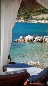 a view of a body of water with a beach at White Hill by Fllad e Vale in Vlorë
