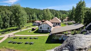 an aerial view of a large building with a grass field at Villa Modum in Skreppen