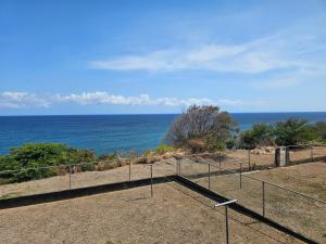 a view of the ocean from the top of a building at Ocean Breeze Retreat in Basseterre