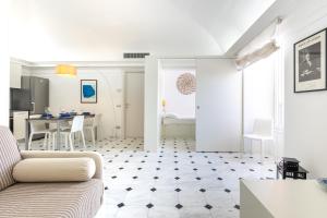 a living room with a couch and a table at Bright Sea View Home, Steps from the Beach in Lavagna