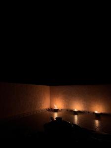 a room with two candles in the dark at Jnan Narjiss atlas in Asni