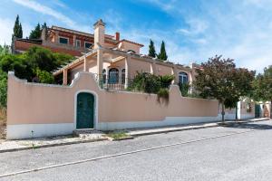 a house on the side of a street at Bela Vista in Azambuja