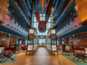 a large room with chairs and tables in a building at Rixos Tersane Istanbul in Istanbul