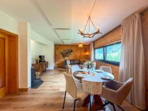 a dining room with a table and chairs at Jagerhütte in Mallnitz