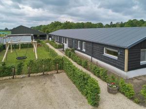 an aerial view of a house with a playground at Sientjeshof 1 in Diessen