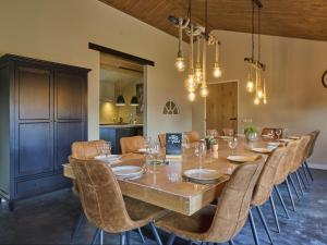 a large dining room with a long table and chairs at Sientjeshof 2 in Diessen