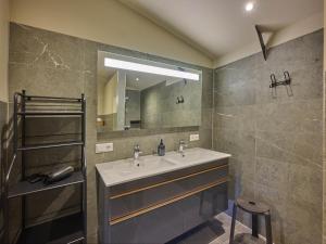 a bathroom with a sink and a mirror at Sientjeshof 1 in Diessen +55 photos
