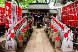 a temple with a row of statues in front of it at Super Hotel Premier Akasaka in Tokyo