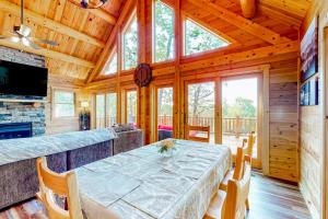 a dining room with a table in a cabin at Deep Creek Mountain Retreat in McHenry +42 photos