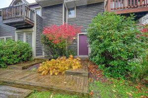 a house with a wooden walkway in front of it at Hibernation Hideaway in McHenry